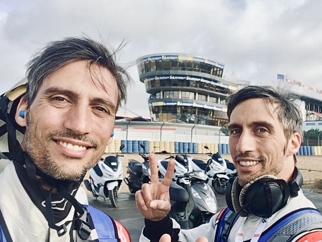Luca and Gabriele Stifani working trackside at a motor-racing circuit