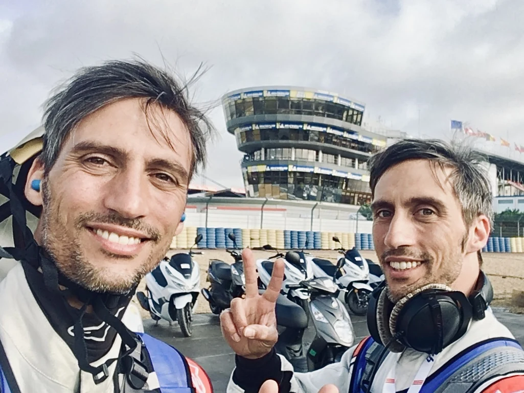 Luca and Gabriele Stifani working trackside at a motor-racing circuit
