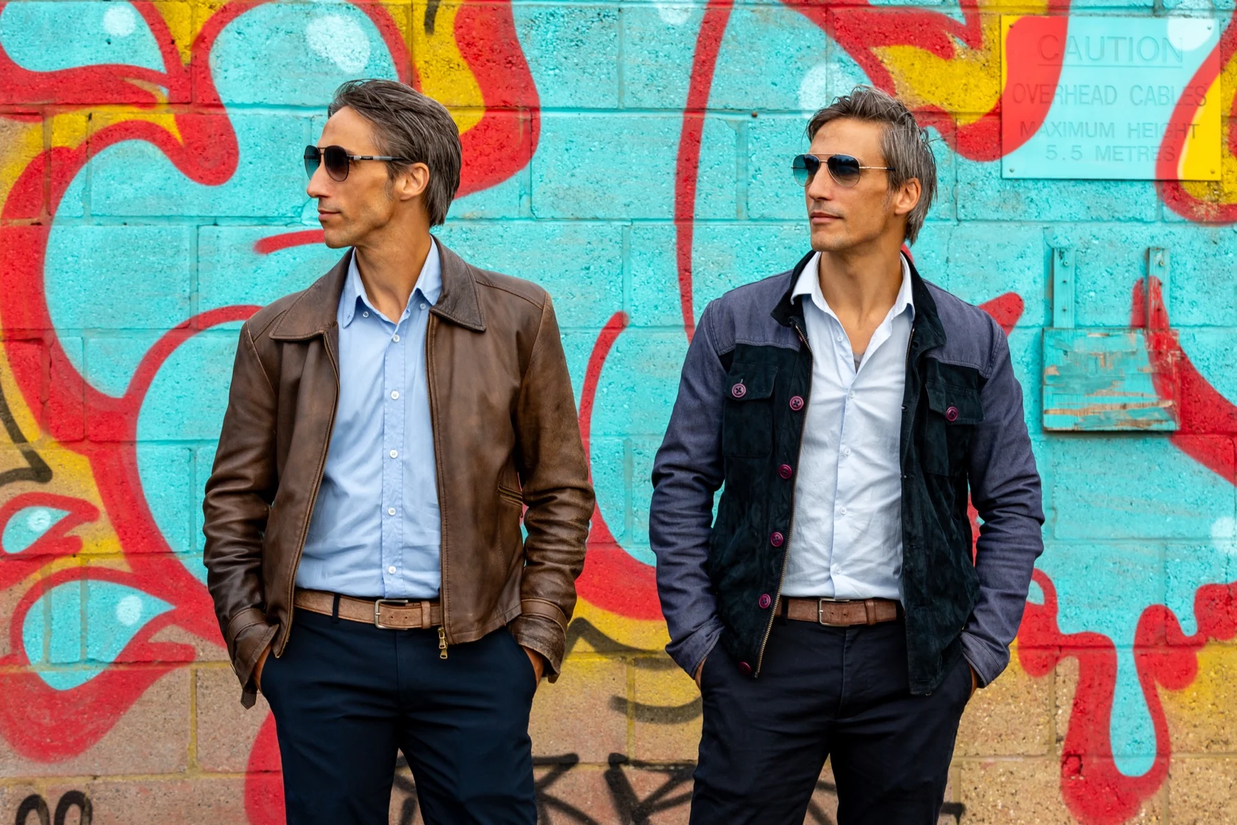 Luca and Gabriele Stifani together in front of a colourful mural
